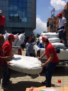 Save the Children staff unload supplies