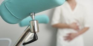 Treatment table, female patient in background