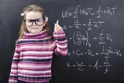 Cute girl in front of a chalboard
