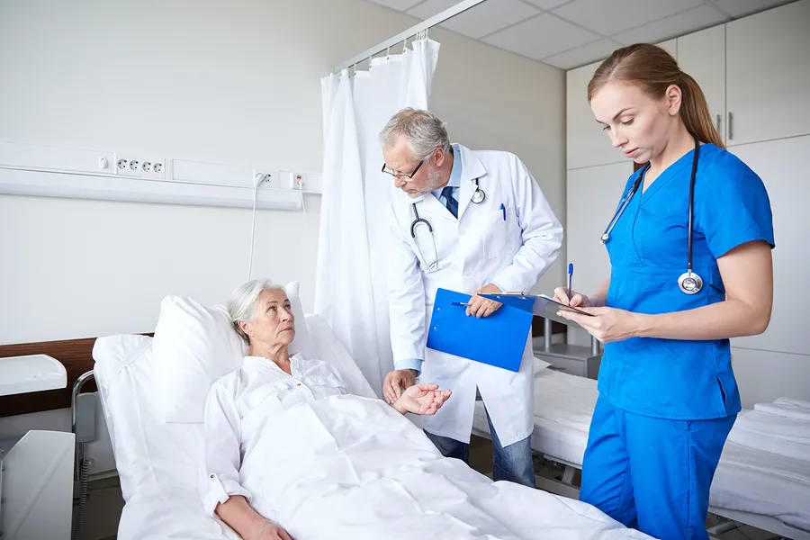 medicine, age, health care and people concept - doctor and nurse