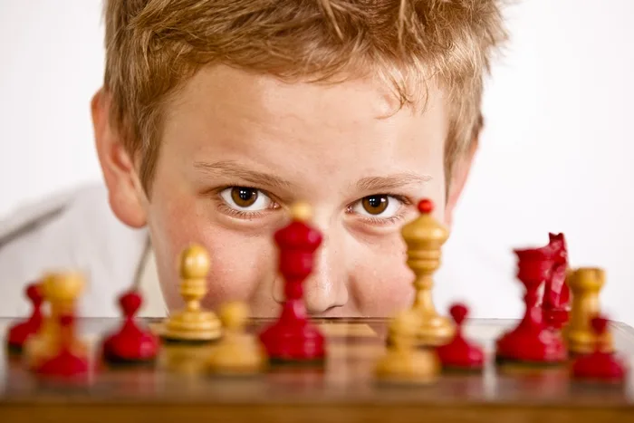Boy playing chess